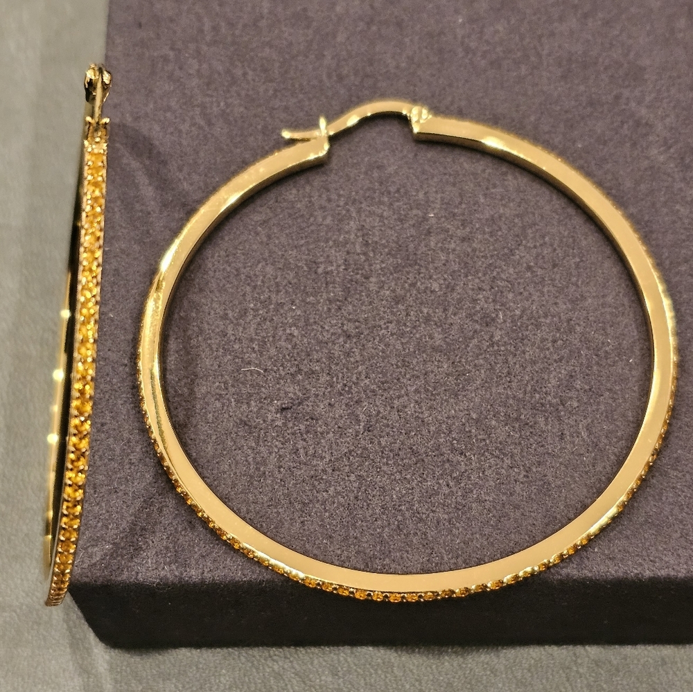Citrine 2.25" hoop earrings set in 14k gold plated sterling silver. Hinged clasp